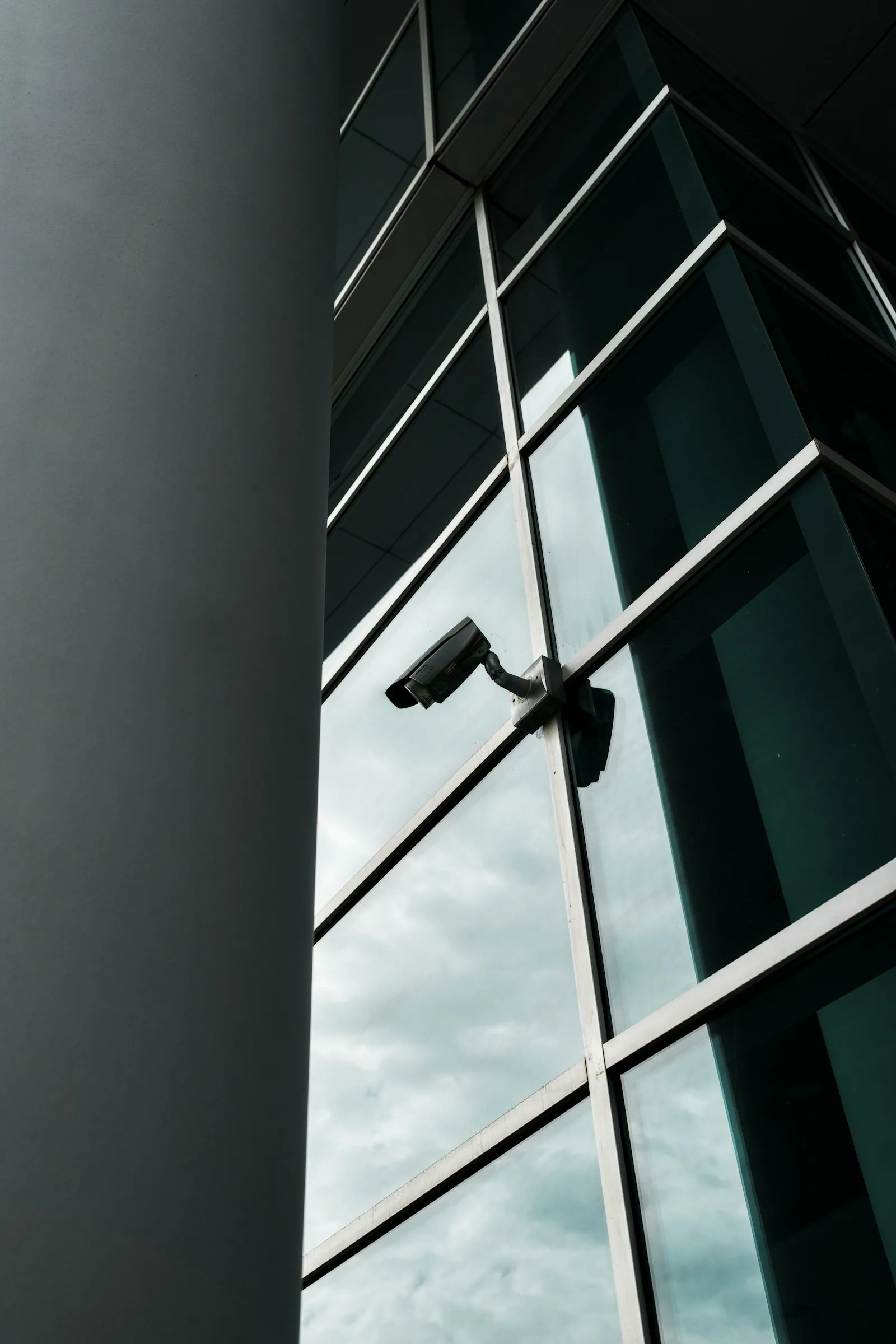 A security camera mounted on a modern office building
