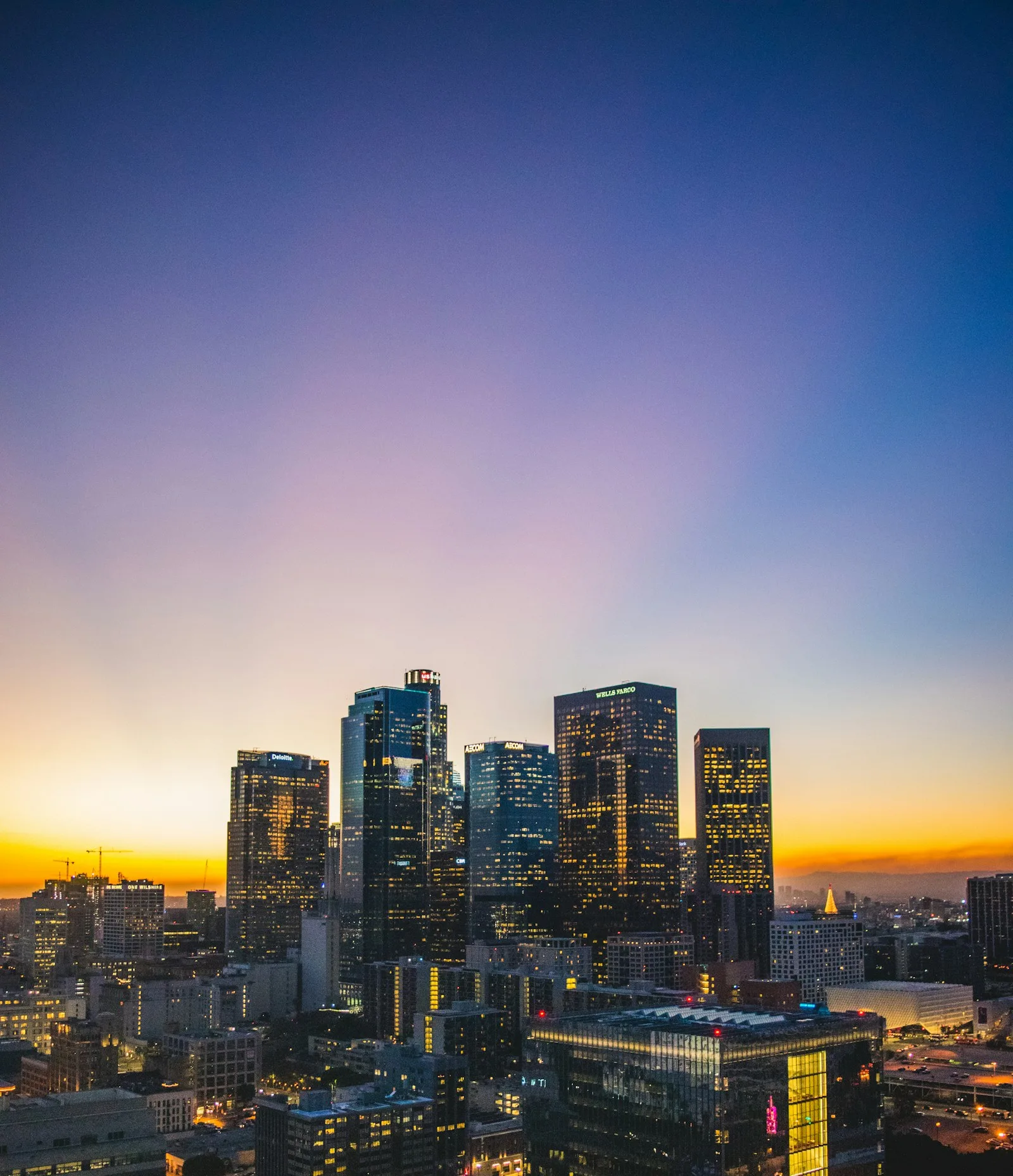 A financial district skyline illuminated at dusk