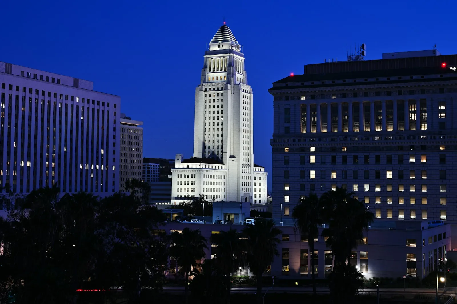 A city government building illuminated after dark