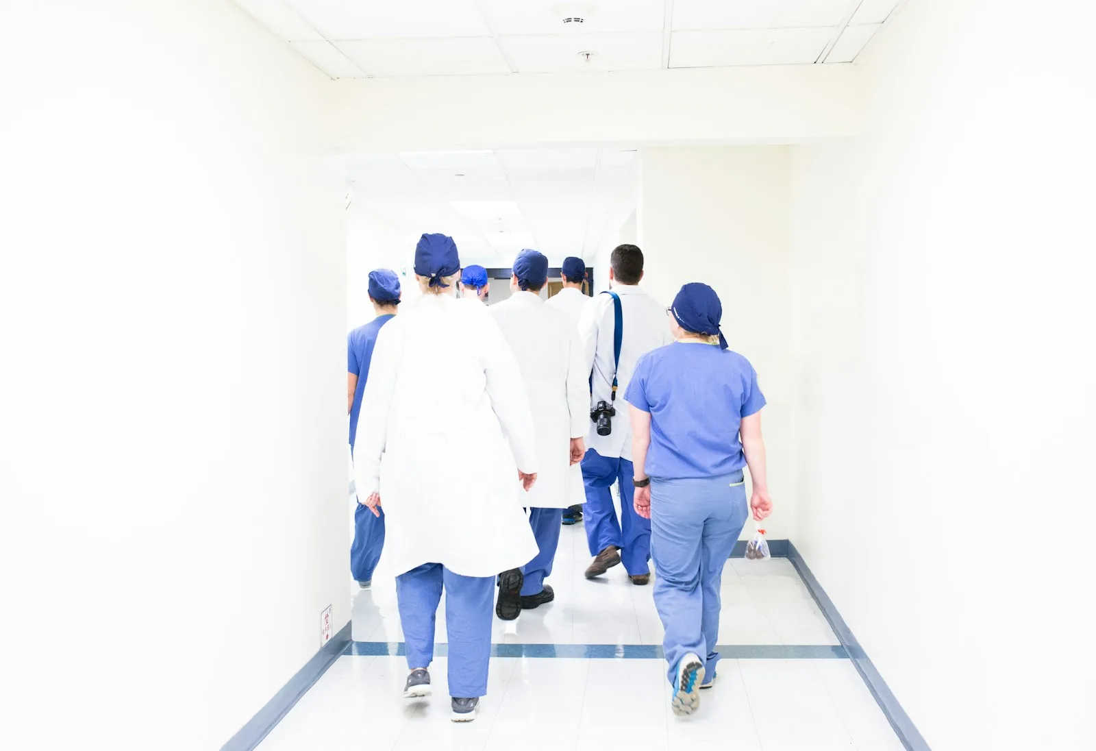 A medical team walking together through a hospital corridor