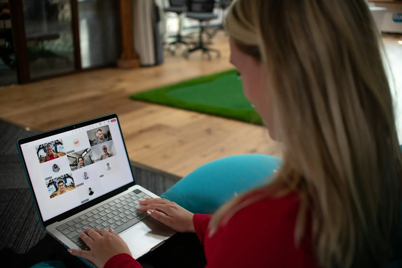 A professional joining a video meeting from a laptop